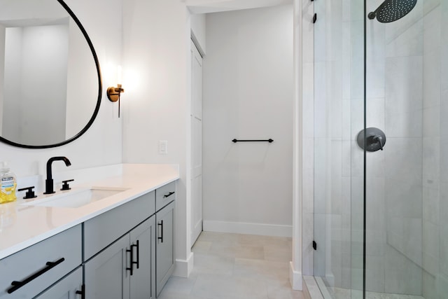 bathroom with vanity and a shower with shower door