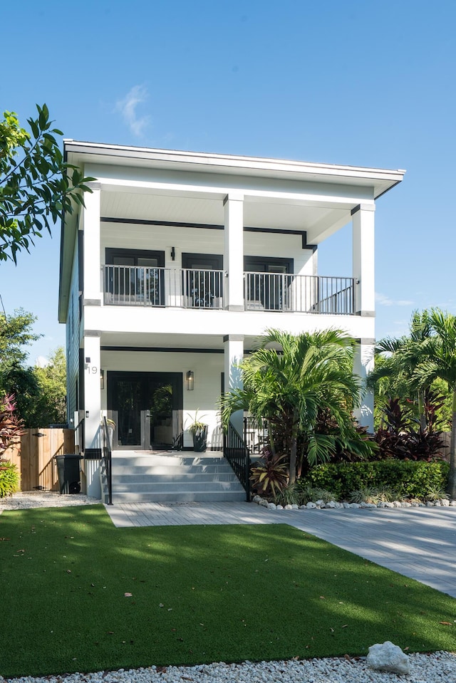 back of property featuring a lawn