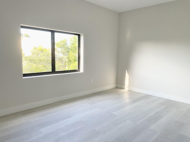 unfurnished room featuring light wood-type flooring