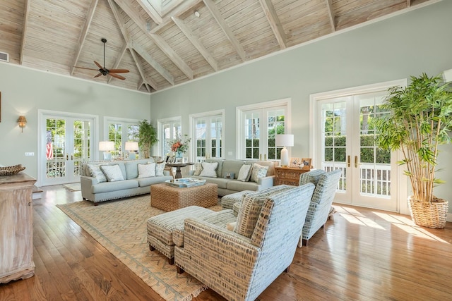 living room featuring french doors, high vaulted ceiling, wood ceiling, and hardwood / wood-style floors