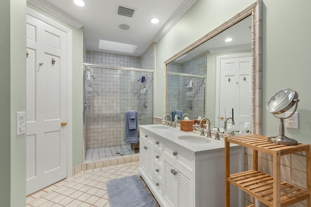 bathroom with walk in shower, vanity, tile patterned floors, and a skylight