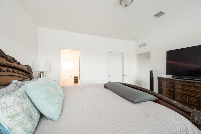 bedroom featuring connected bathroom