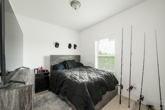 bedroom with light hardwood / wood-style floors