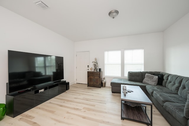 living room with light hardwood / wood-style floors