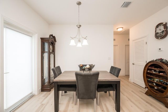 dining room featuring a wealth of natural light and light wood-type flooring