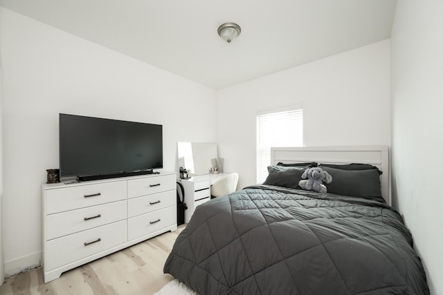 bedroom with light wood-type flooring