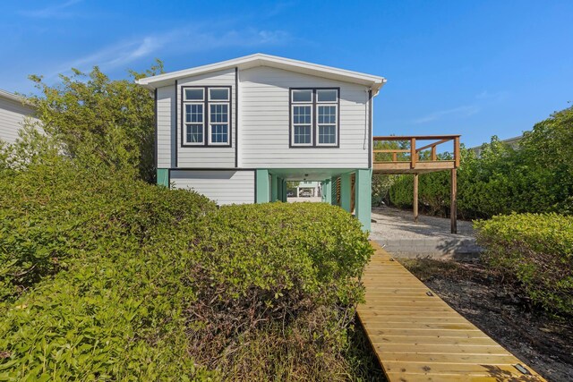 exterior space featuring a carport