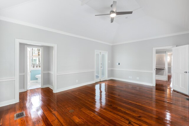 unfurnished room with crown molding, ceiling fan, dark hardwood / wood-style flooring, and vaulted ceiling