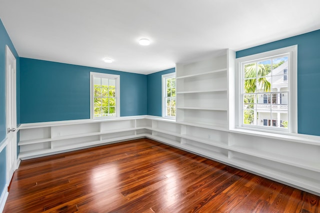 spare room featuring dark hardwood / wood-style floors