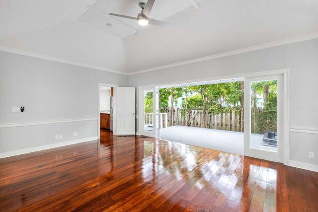 spare room featuring crown molding, ceiling fan, dark hardwood / wood-style floors, and high vaulted ceiling