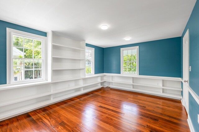 empty room with hardwood / wood-style floors