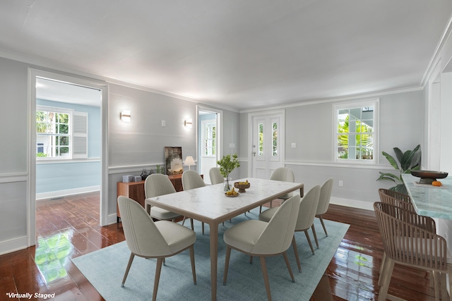 dining area featuring crown molding and dark hardwood / wood-style flooring