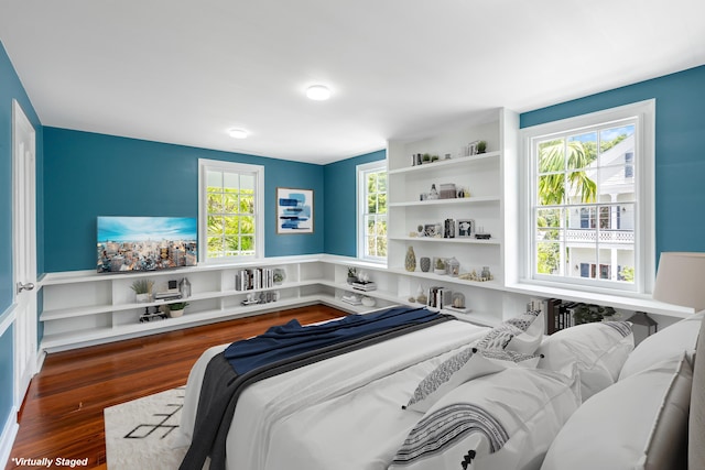 bedroom featuring dark hardwood / wood-style flooring