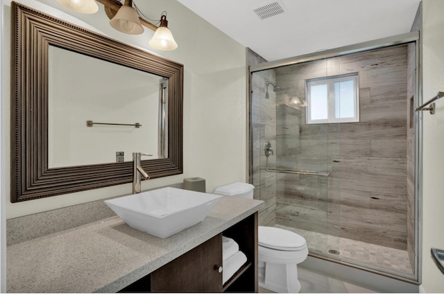 bathroom with walk in shower, vanity, and toilet