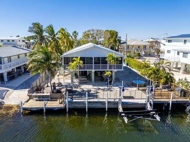 dock area featuring a patio and a water view