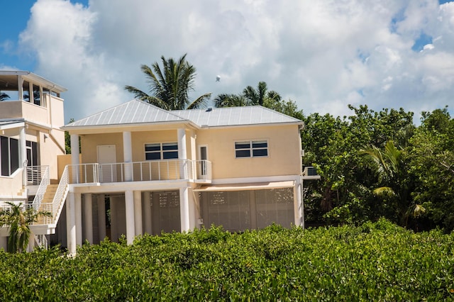 rear view of house with a garage