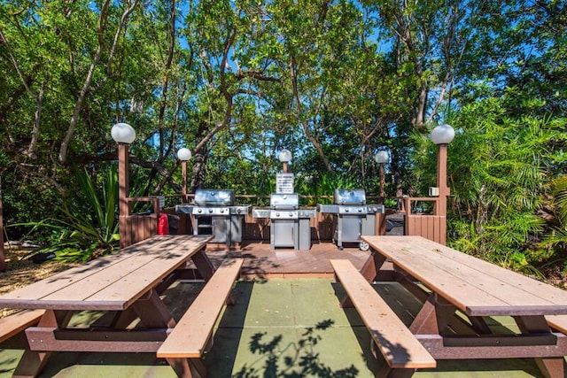 1901 S Roosevelt Blvd Unit 404S, Key West, FL 33040 - wooden terrace featuring outdoor dining space and a grill