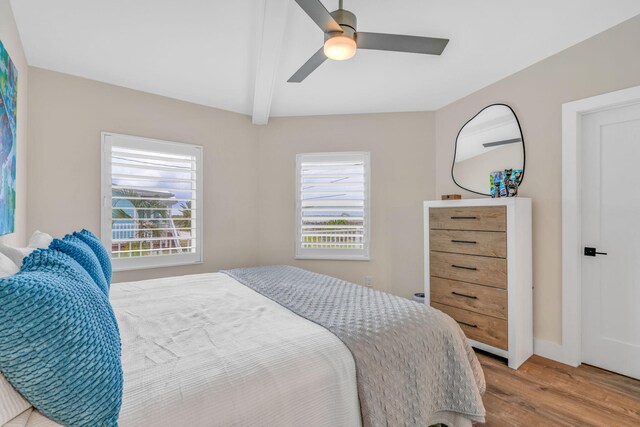 273 Indies Rd, Ramrod, FL 33042 - bedroom featuring wood finished floors, beamed ceiling, and a ceiling fan