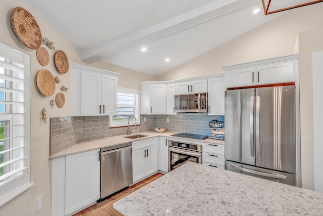 273 Indies Rd, Ramrod, FL 33042 - kitchen featuring stainless steel appliances, decorative backsplash, white cabinetry, light wood-style flooring, and recessed lighting