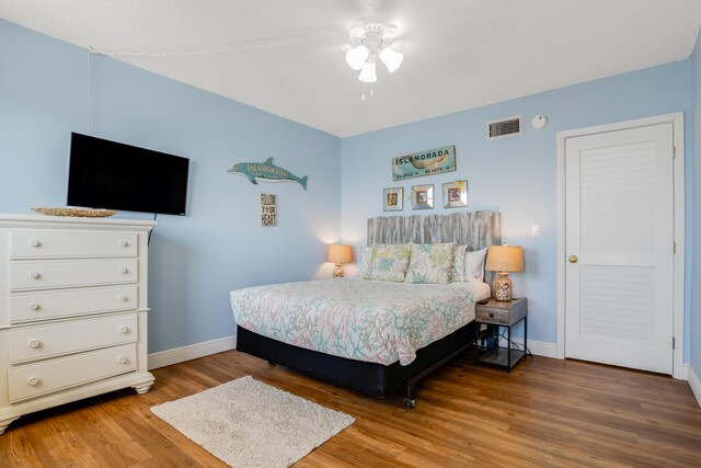 200 Wrenn Street Ph 701, Tavernier, FL 33070 - bedroom featuring wood finished floors, baseboards, and ceiling fan