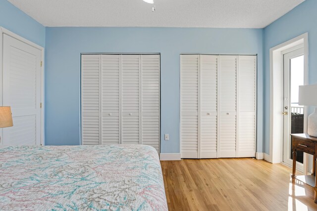 200 Wrenn Street Ph 701, Tavernier, FL 33070 - bedroom with multiple closets, wood finished floors, and baseboards