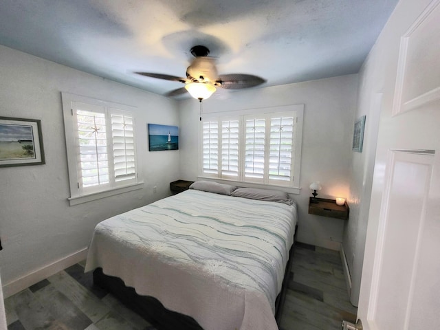 bedroom featuring hardwood / wood-style floors and ceiling fan