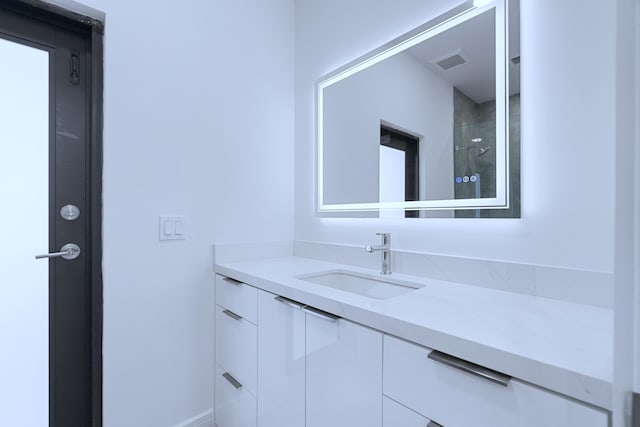 bathroom with vanity and visible vents