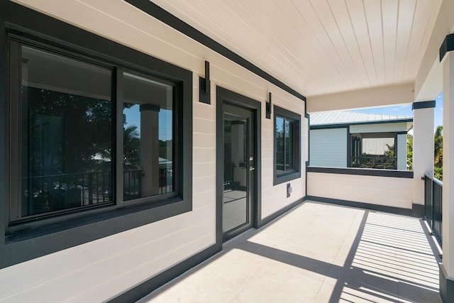 view of patio featuring a balcony