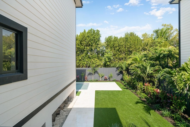 view of yard featuring a fenced backyard and a patio area