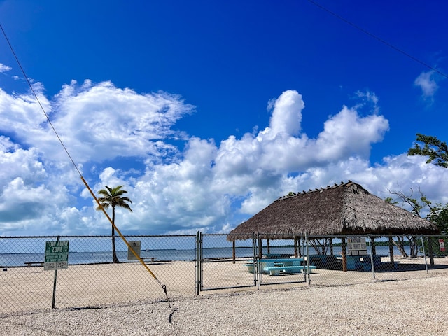 view of property's community with a gazebo and a water view