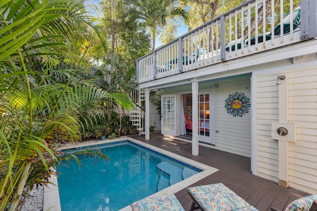 view of swimming pool with a deck