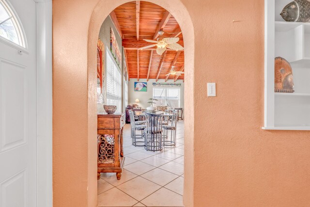 60 Bahama Ave, Key Largo, FL 33037 - hallway featuring arched walkways, tile patterned flooring, wood ceiling, beamed ceiling, and a textured wall