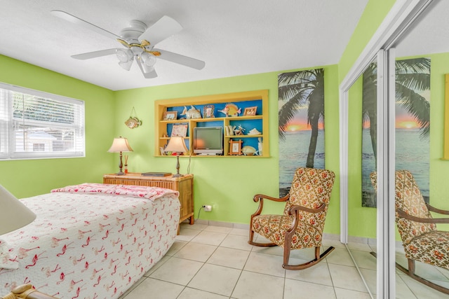 60 Bahama Ave, Key Largo, FL 33037 - tiled bedroom featuring baseboards and a ceiling fan