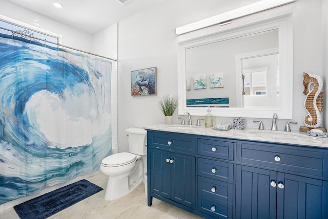 bathroom with vanity, toilet, and walk in shower