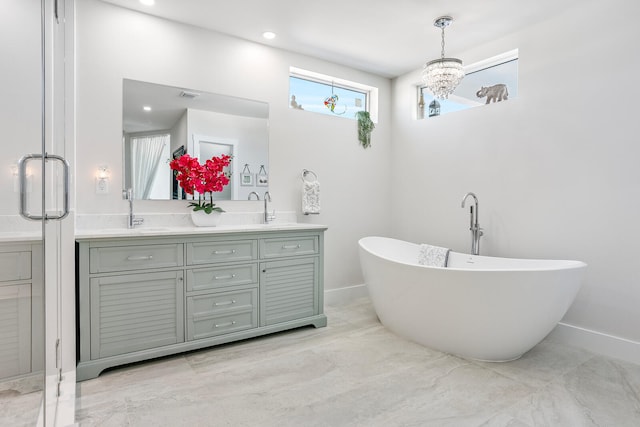 bathroom featuring vanity and a tub