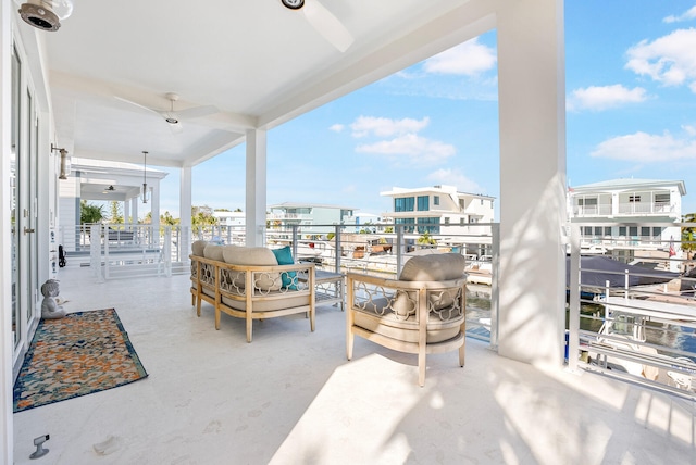 view of patio / terrace featuring a balcony and ceiling fan