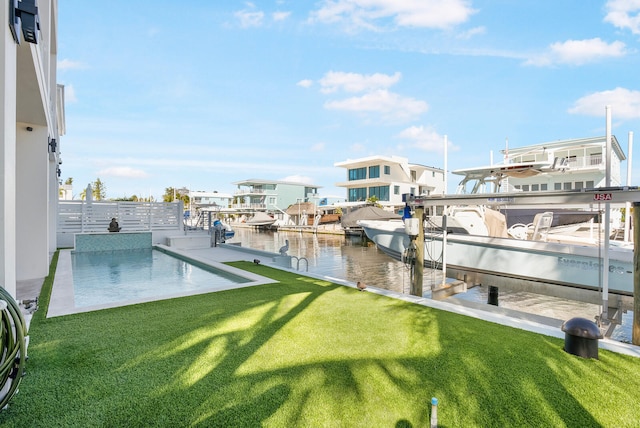 dock area featuring a yard and a water view