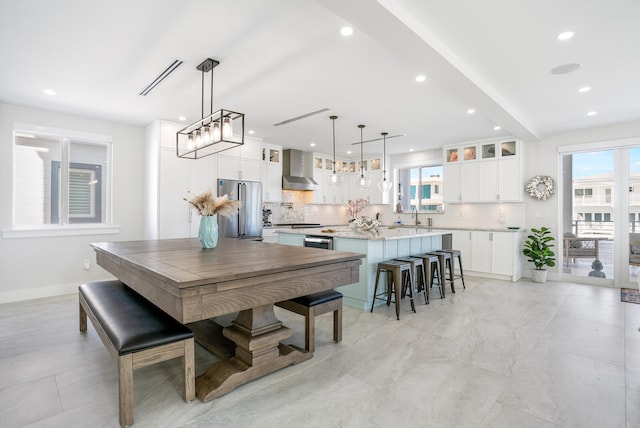 dining space with plenty of natural light and sink