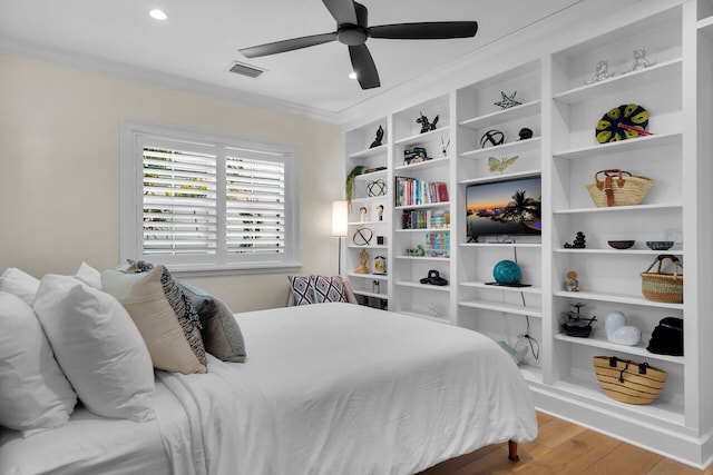 205 Virginia St, Key West, FL 33040 - bedroom with wood finished floors, crown molding, a ceiling fan, and recessed lighting