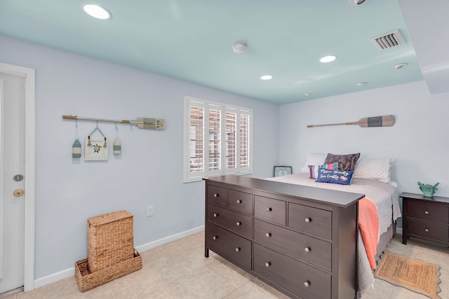 bedroom with light tile patterned floors