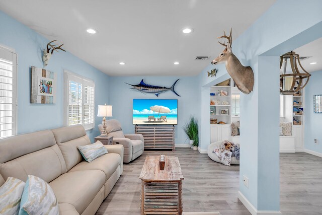 living room with light hardwood / wood-style floors