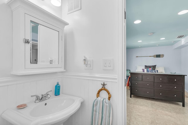 bathroom featuring tile patterned flooring and sink