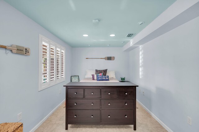 bedroom with light tile patterned flooring