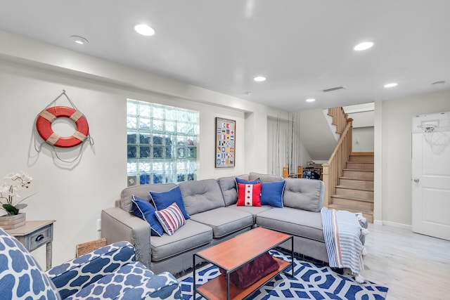 living room with light hardwood / wood-style flooring