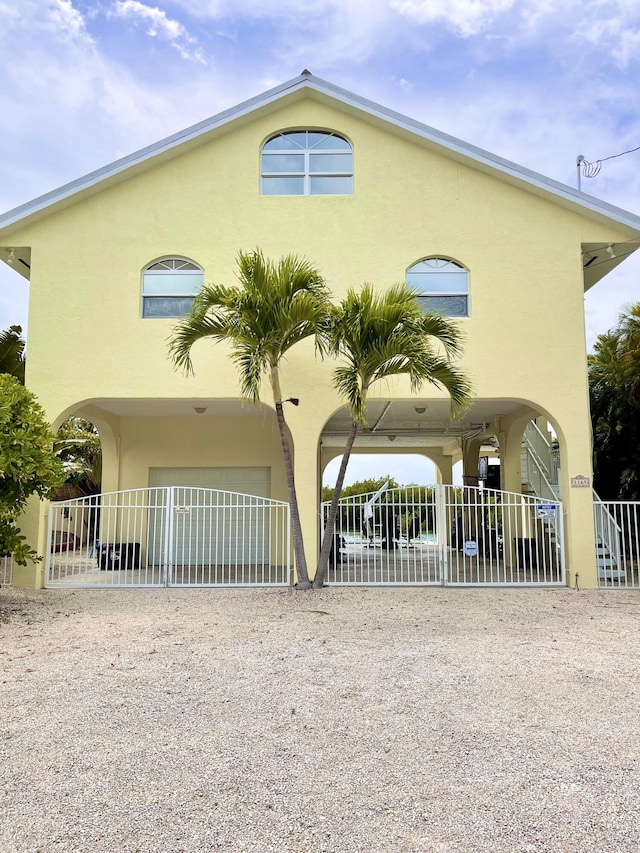 1165 Lagoon Dr, Summerland, FL 33042 - view of front facade featuring stucco siding and fence