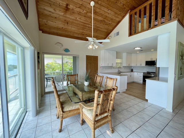 1165 Lagoon Dr, Summerland, FL 33042 - dining room with wooden ceiling, healthy amount of natural light, high vaulted ceiling, light tile patterned floors, and a ceiling fan