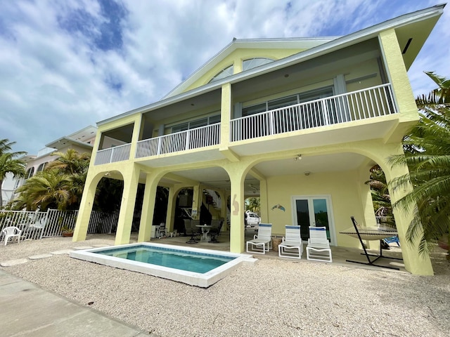 1165 Lagoon Dr, Summerland, FL 33042 - back of property with a patio, fence, an outdoor pool, a balcony, and stucco siding
