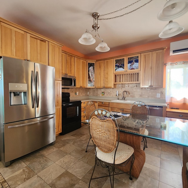kitchen featuring stainless steel appliances, light countertops, backsplash, and glass insert cabinets