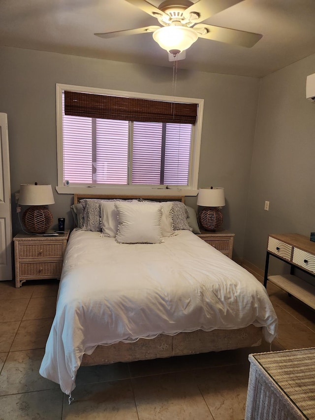 tiled bedroom with a ceiling fan, a wall mounted air conditioner, and multiple windows