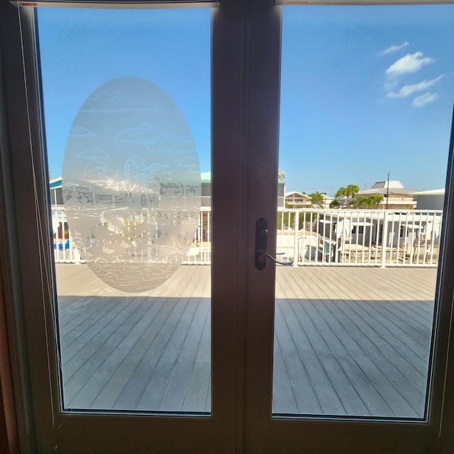109 S Layton Dr Unit 1 & 2, Layton, FL 33001 - entryway with french doors and wood finished floors